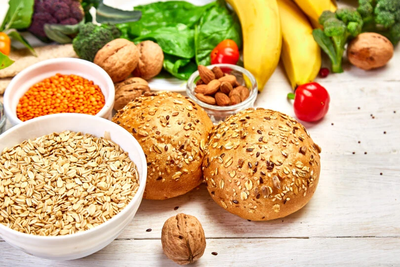 high-fiber-foods-on-white-wooden-background-2021-08-26-17-17-22-utc-810x540